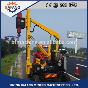 Hydraulic highway guardrail pile driver for traffic crash barrier construction